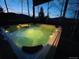 Hot tub glowing on deck at night at 20600 Rangeview Dr, Morrison, CO 80465