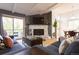 Relaxing living room with stone fireplace and stylish furniture at 20600 Rangeview Dr, Morrison, CO 80465