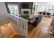 Open-concept living area with hardwood floors, stone fireplace, and scenic views from the deck at 20600 Rangeview Dr, Morrison, CO 80465
