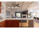 Bright living space with a modern ceiling fan, a cozy fireplace, and an open floor plan at 20600 Rangeview Dr, Morrison, CO 80465