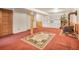 Spacious basement area featuring built-in shelving and wood-burning stove at 8473 Gray Fox Dr, Evergreen, CO 80439