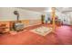 Cozy basement with a wood-burning stove and ample space for living and entertaining at 8473 Gray Fox Dr, Evergreen, CO 80439