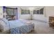 Relaxing bedroom features a glass door to the deck and a view outside with carpet at 8473 Gray Fox Dr, Evergreen, CO 80439