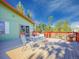 Outdoor wooden deck with patio seating and beautiful views of the backyard at 8473 Gray Fox Dr, Evergreen, CO 80439