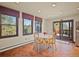 Bright dining area with views to deck, large windows, and plenty of natural light at 8473 Gray Fox Dr, Evergreen, CO 80439