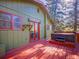Back deck and hot tub offer outdoor relaxation and entertainment options at 8473 Gray Fox Dr, Evergreen, CO 80439
