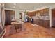 Well-appointed kitchen features custom wood cabinetry, tile flooring, granite countertops, and modern appliances at 8473 Gray Fox Dr, Evergreen, CO 80439