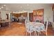 Open eat-in kitchen includes brick fireplace, stainless appliances, and ample cabinets at 8473 Gray Fox Dr, Evergreen, CO 80439