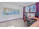 Home office with natural light, desk, chair, and wall maps to complete the look at 8473 Gray Fox Dr, Evergreen, CO 80439