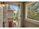 Private outdoor balcony of a charming townhome featuring private entrances and lush green landscaping at 18761 E Water Dr # F, Aurora, CO 80013