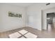 A bedroom featuring light colored hardwood floors and a window with trees outside at 18761 E Water Dr # F, Aurora, CO 80013