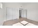 Spacious bedroom featuring hardwood floors and a closet with paneled sliding doors at 18761 E Water Dr # F, Aurora, CO 80013