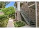 Charming townhome featuring a stone facade, private entrances, and lush green landscaping at 18761 E Water Dr # F, Aurora, CO 80013