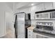 Functional kitchen area with stainless steel appliances and a convenient layout at 18761 E Water Dr # F, Aurora, CO 80013