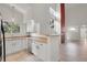 Well-lit kitchen seamlessly connected to the living room, perfect for modern living at 18761 E Water Dr # F, Aurora, CO 80013