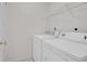 Close-up view of a clean and functional laundry area with updated appliances at 18761 E Water Dr # F, Aurora, CO 80013