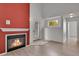 Inviting living room featuring a cozy fireplace, lots of natural light, and vaulted ceilings at 18761 E Water Dr # F, Aurora, CO 80013