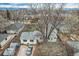 A high aerial view of the property showing surrounding neighborhood homes and garages at 1824 S Logan St, Denver, CO 80210