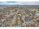 A wide aerial view showcases the property's location within the broader city landscape and neighborhood at 1824 S Logan St, Denver, CO 80210