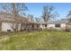 A large yard with green grass and an outdoor patio and grilling space at 1824 S Logan St, Denver, CO 80210