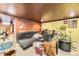 A spacious basement including a drum set and a couch at 1824 S Logan St, Denver, CO 80210