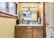 Bathroom featuring a double sink vanity with ample cabinet space and a well-lit mirror at 1824 S Logan St, Denver, CO 80210
