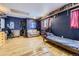 Spacious bedroom with a single bed, hardwood floors, closet and plenty of room for customization at 1824 S Logan St, Denver, CO 80210