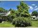 Charming home with decorative shingles and lush foliage surrounding the entrance at 1824 S Logan St, Denver, CO 80210