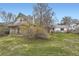 Charming home featuring a well-manicured front lawn with a blossoming yellow shrub at 1824 S Logan St, Denver, CO 80210