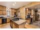 Spacious kitchen featuring a unique map design on the walls and a functional island cooktop at 1824 S Logan St, Denver, CO 80210