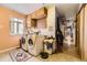 Bright laundry room with washer, dryer, storage cabinets, and a practical layout at 1824 S Logan St, Denver, CO 80210