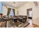 Spacious living room featuring hardwood floors, ample seating, and natural light at 1824 S Logan St, Denver, CO 80210