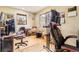 Functional office space featuring hardwood floors, two windows with natural light, and two chairs at 1824 S Logan St, Denver, CO 80210