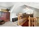 Loft space with carpet, storage and wooden stair railings at 4968 Alcott St, Denver, CO 80221