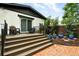 Charming backyard with a deck, outdoor seating, and well-maintained landscaping at 4968 Alcott St, Denver, CO 80221