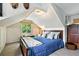 Bright bedroom with paneled walls, blue bedding, and a cozy feel at 4968 Alcott St, Denver, CO 80221