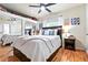 Comfortable bedroom with a large bed, mirrored closet, and ample natural light from the window at 4968 Alcott St, Denver, CO 80221