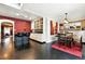 Inviting kitchen and dining area featuring modern bar seating and stylish decor at 4968 Alcott St, Denver, CO 80221