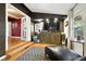 Relaxing living room with a stylish cabinet, comfortable chair, and open layout at 4968 Alcott St, Denver, CO 80221