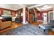 Inviting living room featuring hardwood floors, fireplace, and striking accent wall at 4968 Alcott St, Denver, CO 80221