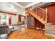 Spacious living room with hardwood floors, stylish decor, and a classic staircase at 4968 Alcott St, Denver, CO 80221