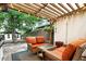 Relaxing outdoor patio with cozy seating, pergola, and string lights at 4968 Alcott St, Denver, CO 80221