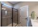 Modern bathroom with a tiled shower and sleek glass door at 9843 Rosalee Peak St, Littleton, CO 80125