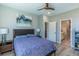 Comfortable bedroom with ceiling fan and ensuite bathroom at 9843 Rosalee Peak St, Littleton, CO 80125
