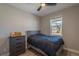 Cozy bedroom with a window view and neutral decor at 9843 Rosalee Peak St, Littleton, CO 80125