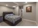 Cozy bedroom showcasing a comfortable bed and neutral decor at 9843 Rosalee Peak St, Littleton, CO 80125