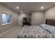 Comfortable bedroom featuring a bed, carpeted floors, and a window at 9843 Rosalee Peak St, Littleton, CO 80125