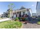 Inviting home featuring a covered front porch with seating and a beautifully landscaped front yard at 9843 Rosalee Peak St, Littleton, CO 80125