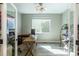 Bright home office with natural light and ample workspace at 9843 Rosalee Peak St, Littleton, CO 80125