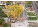 Aerial view showing a charming home with a large yard and detached garage at 1545 Newport St, Denver, CO 80220